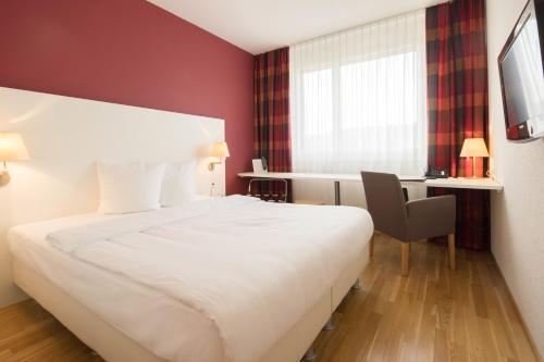 Postel nebo postele na pokoji v ubytování Hotel Arcade