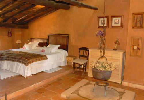 Кровать или кровати в номере Casa Rural Donatila