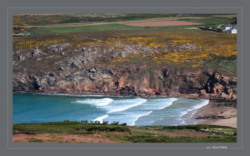 an aerial view of a beach and a cliff at Hôtel de la Baie des Trépassés in Plogoff