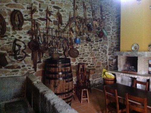 a room with a bunch of pots and utensils at Curral de l Tiu Pino in Sendim