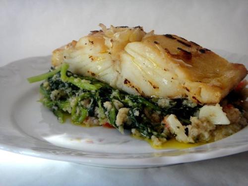 a plate of food with a piece of fish at Curral de l Tiu Pino in Sendim