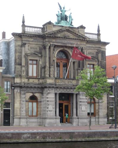 a building with a flag in front of it at Bed & Breakfast Frans Hals Haarlem in Haarlem