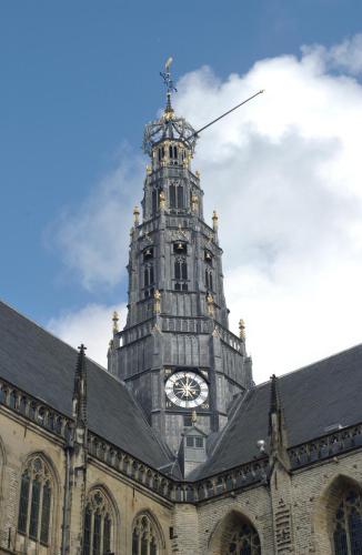 a building with a clock tower on top of it at Bed & Breakfast Frans Hals Haarlem in Haarlem