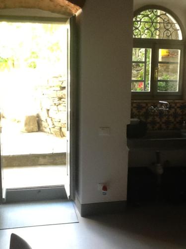 an open door in a room with a window at Garden Apartment in Greve in Chianti