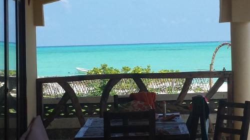 a view of the ocean from the balcony of a resort at White Sands in Paje