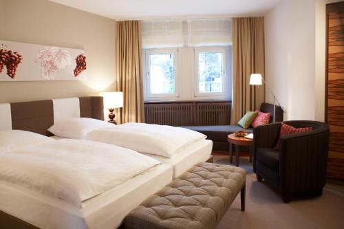 Postel nebo postele na pokoji v ubytování Hotel Ritter Durbach