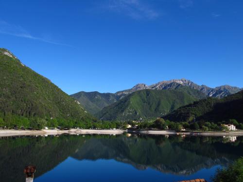 a view of a lake with mountains in the background at Camping Al Lago Ledro in Ledro