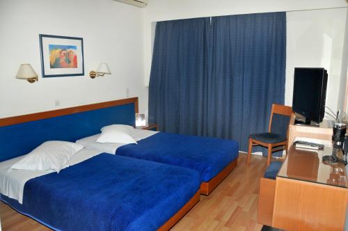 Кровать или кровати в номере Hotel Elena