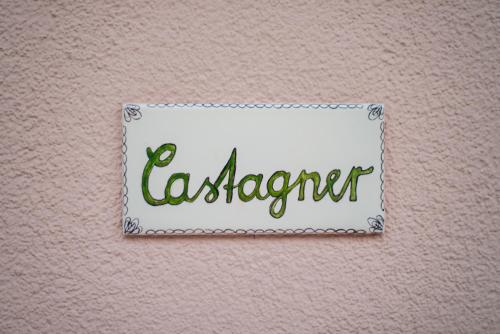 a sign on a wall with the word elegance at La Gazza Ladra Apartments - Garda Chill Out in Drena