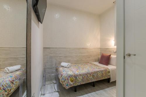Letto o letti in una camera di Hostal Met Madrid