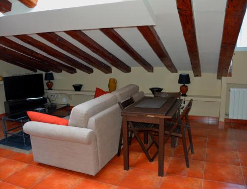 a living room with a couch and a table at For You Rentals Madrid City Center - Puerta del Sol COR2 in Madrid