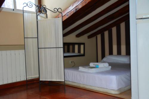 a bedroom with a bed with a mirror next to it at For You Rentals Madrid City Center - Puerta del Sol COR2 in Madrid