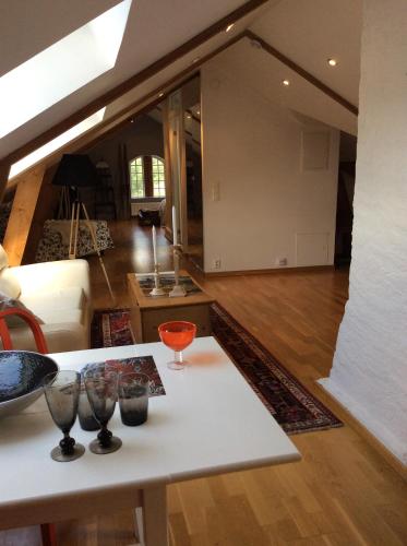 a living room with a table with glasses on it at Gothenburg View Apartment in Gothenburg