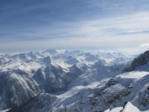 an aerial view of a snowy mountain range at Casa Bamby in Cogolo