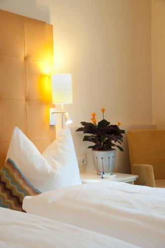 Postel nebo postele na pokoji v ubytování Hotel Mehl