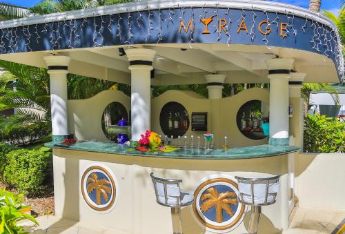 a gazebo at a resort with a bar at Lifestyle Crown Residence Suites in San Felipe de Puerto Plata
