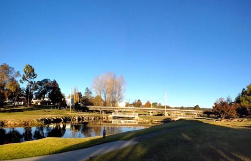 a lake with a bridge over it at Boulevard Motel in Stanthorpe