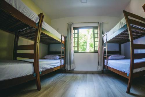 Cama ou camas em um quarto em Hostel Refúgio
