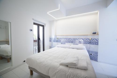 Postel nebo postele na pokoji v ubytování La Majolica