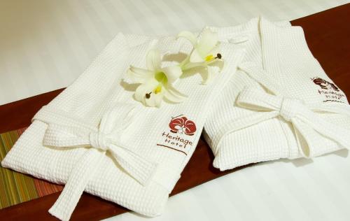 Postel nebo postele na pokoji v ubytování Heritage Hotel