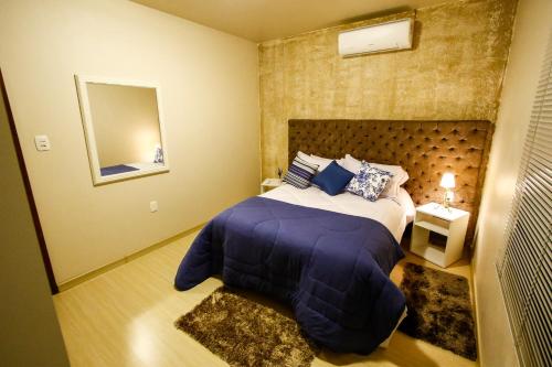 Llit o llits en una habitació de Apartamento Aconchegante Na Serra