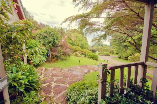 a view of a garden from the porch of a house at Mt Glorious Getaways in Mount Glorious