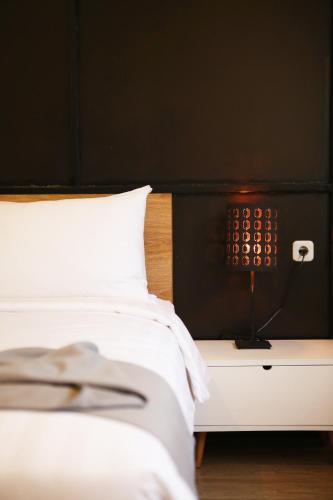 Ένα ή περισσότερα κρεβάτια σε δωμάτιο στο Allstay Ecotel Yogyakarta