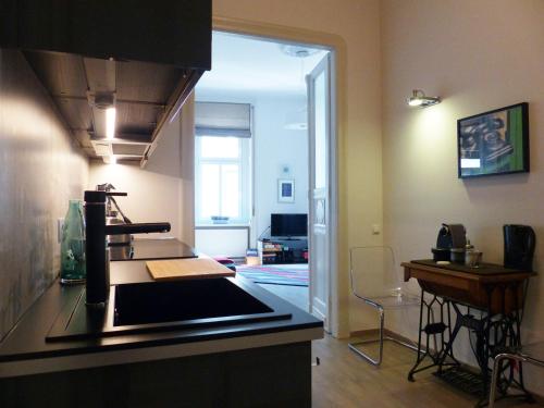 a kitchen with a stove top oven in a room at Apartment 43 in Budapest