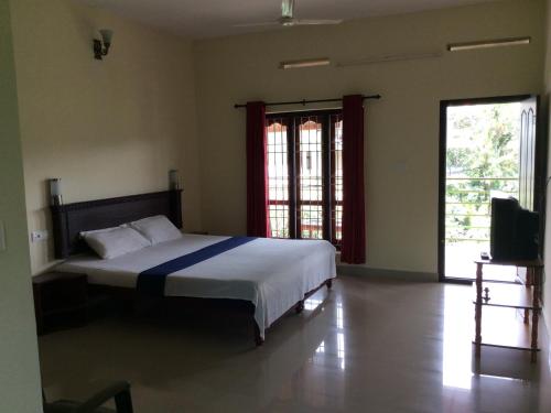 Cama o camas de una habitación en Kerala House