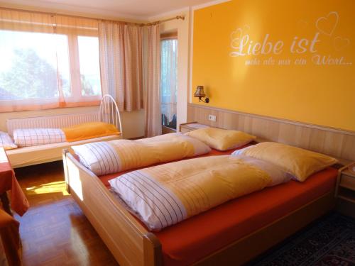 a bedroom with two beds and a sign that says life list what dies at Ferienwohnung Haus Julia in Mariapfarr