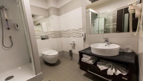 Koupelna v ubytování Hotel Grandis Apulum
