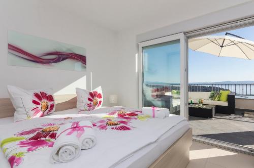 Кровать или кровати в номере Penthouse Sunset Makarska