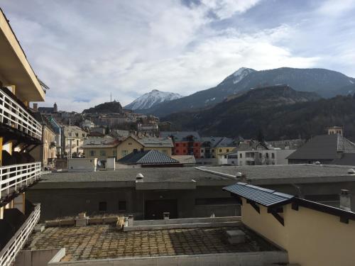 a view of a city with mountains in the background at Hôtel Mont-Brison in Briançon