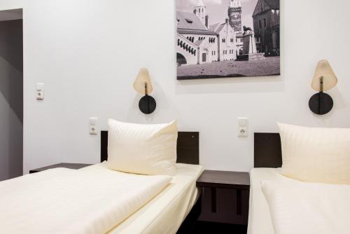 Postel nebo postele na pokoji v ubytování Hotel Fürstenhof