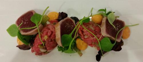 a plate of food with meat and vegetables on it at Stadshotel Rijssen in Rijssen