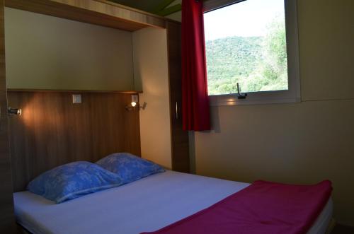 Postel nebo postele na pokoji v ubytování Camping U Libecciu