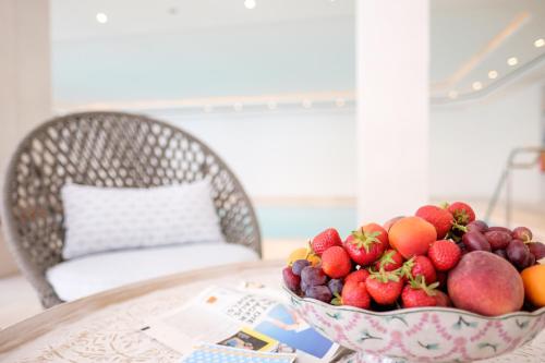 a bowl of fruit sitting on a table at Landhaus am Stein in Bad Wiessee