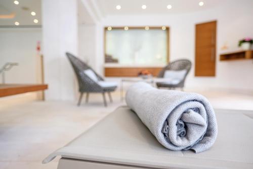 a towel sitting on top of a table at Landhaus am Stein in Bad Wiessee
