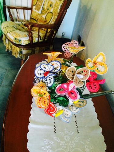 a table with a bunch of colorful buttons on it at Ca di Voi in Calizzano