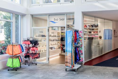 a store with a lot of clothes on display at Kurhotel Im Park in Schinznach Bad
