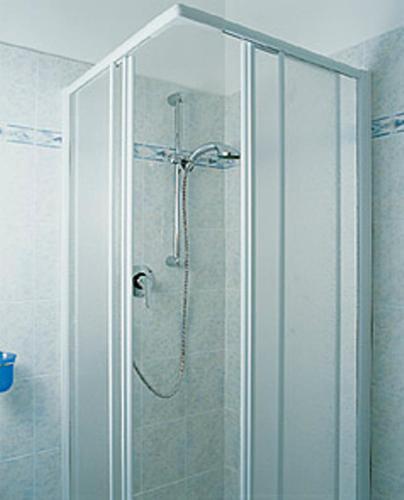 a shower with a glass door in a bathroom at Hotel Conchiglia in Senigallia