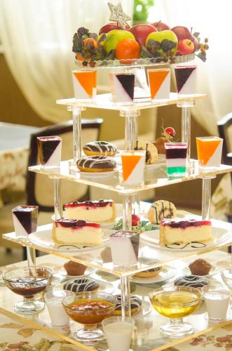 a three tiered display of desserts on a table at Jumbo Hotel in Chişinău