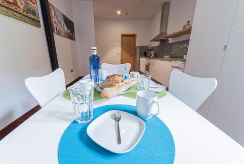 a dining room table with a plate of food on it at Anchieta 60 in La Laguna