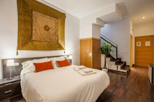 Postel nebo postele na pokoji v ubytování SevillaHome - Marqués de Paradas