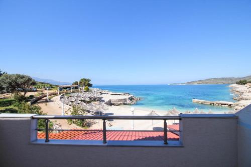 a balcony with a view of a beach and the ocean at Hotel Artur in Ksamil