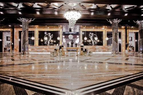 a dance floor in a room with a chandelier at Villas Elenite Premium in Elenite