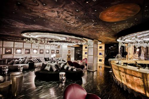 a living room with couches and a bar at Villas Elenite Premium in Elenite