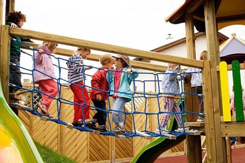 a group of children standing on a playground at Der WALZL in Innsbruck