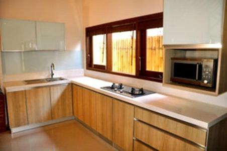 Kuchyň nebo kuchyňský kout v ubytování Ananda Private Villa