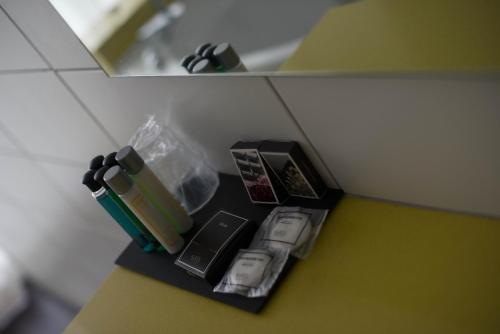 a counter top with items on it in a room at Klass Hotel in Castelfidardo